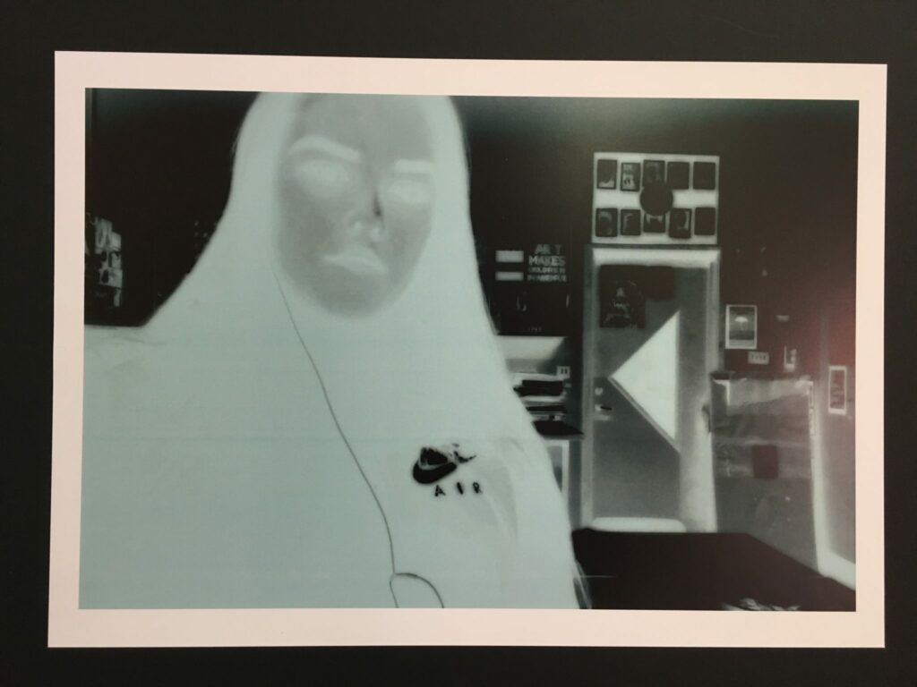 a photo negative of a woman