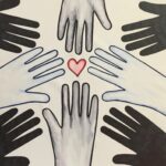 reach for the heart art work with hands reaching for a heart in the centre