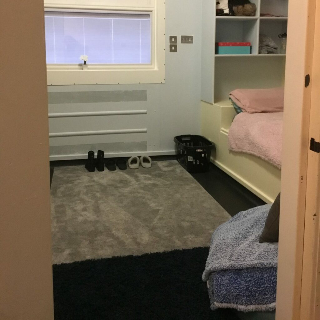 Atkinson bedroom with rug and window